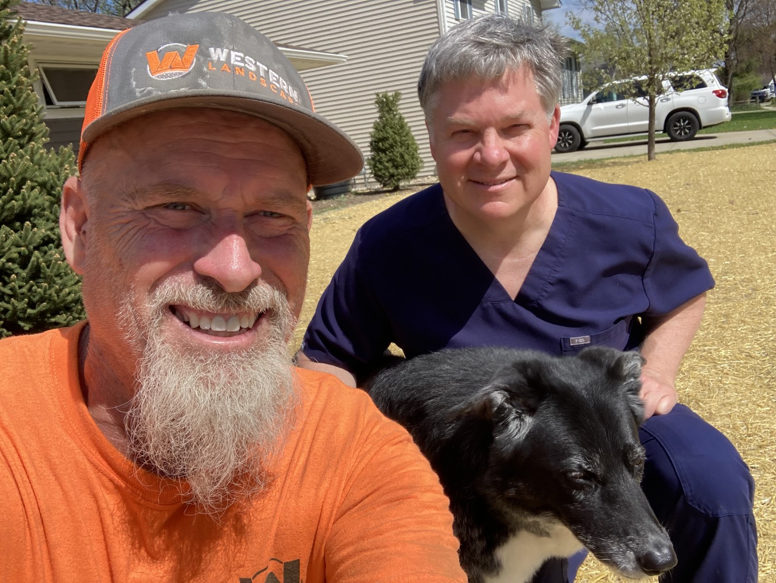 Western Landscape team member with a satisfied homeowner